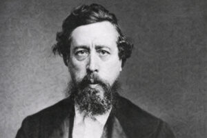 Wilhelm Liebknecht, Porträt im Hochformat, schwarz-weiß, mit Vollbart und Anzug in den 1870er Jahren