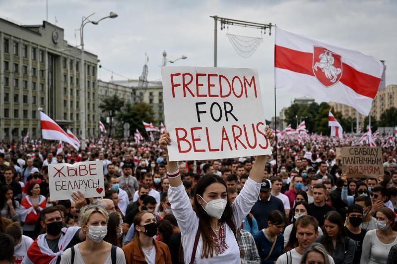 Peaceful demonstration in Belarus symbolizing the country's pro-democracy movement and political persecution.